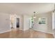 Open-concept living area showcasing updated flooring and a passthrough to kitchen at 680 Circlewood Dr # W3, Venice, FL 34293