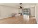 Light-filled living room with wood floors and sliding glass doors to the patio at 680 Circlewood Dr # W3, Venice, FL 34293
