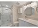 Updated bathroom featuring a frameless glass shower and modern vanity with a white countertop at 700 Golden Beach Blvd # 115, Venice, FL 34285