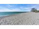 Expansive white sand beach featuring calm, clear waters, perfect for sunbathing and swimming at 700 Golden Beach Blvd # 115, Venice, FL 34285
