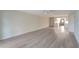 Open concept living room with lots of natural light and neutral paint colors throughout at 700 Golden Beach Blvd # 115, Venice, FL 34285