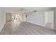 Bright living room featuring an open floor plan and luxury vinyl plank flooring throughout at 700 Golden Beach Blvd # 115, Venice, FL 34285
