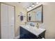 Bathroom featuring a vanity with a marble countertop, a large mirror, and a towel rack at 726 Bird Bay W Dr # 153, Venice, FL 34285