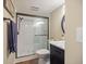 Bathroom featuring a vanity with a marble countertop, updated fixtures, and a glass shower at 726 Bird Bay W Dr # 153, Venice, FL 34285