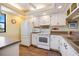 Efficient galley kitchen with white appliances and plenty of cabinet space at 726 Bird Bay W Dr # 153, Venice, FL 34285