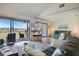Bright living room with vaulted ceilings and sliding glass doors to the screened lanai with great golf course views at 726 Bird Bay W Dr # 153, Venice, FL 34285