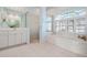 Luxurious bathroom featuring a soaking tub, walk-in shower, and double vanity at 744 Fringed Orchid Trl, Venice, FL 34293