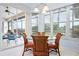 Inviting breakfast nook with large windows, tile floor, and outside views at 744 Fringed Orchid Trl, Venice, FL 34293