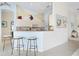 Well-lit kitchen featuring a breakfast bar and modern appliances, perfect for casual dining at 744 Fringed Orchid Trl, Venice, FL 34293