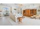 Spacious open living room with dining area, high ceilings, and built in shelving at 744 Fringed Orchid Trl, Venice, FL 34293