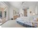 Spacious main bedroom with lanai access and coastal decor at 744 Fringed Orchid Trl, Venice, FL 34293