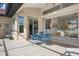 Patio with blue chairs and an open view to living room and the kitchen at 744 Fringed Orchid Trl, Venice, FL 34293