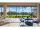 The screened in patio offers a great view of the lake and tropical foliage at 744 Fringed Orchid Trl, Venice, FL 34293