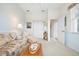 Bright sitting room with half blue wall, neutral walls, and neutral carpet at 744 Fringed Orchid Trl, Venice, FL 34293