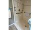 Bathroom showcasing a clean and accessible walk-in shower with grab bars at 795 Cervina N Dr, Venice, FL 34285
