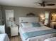 Bright and airy bedroom with a large bed, side tables, and decorative accents at 795 Cervina N Dr, Venice, FL 34285