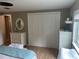 This is a spacious bedroom with ample closet space and bright sunlight from the windows at 795 Cervina N Dr, Venice, FL 34285