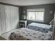 Bedroom featuring two twin beds, large closet, and neutral decor at 795 Cervina N Dr, Venice, FL 34285