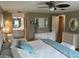 Sun-filled primary bedroom with an ensuite bath, plenty of closet space, and comfortable decor at 795 Cervina N Dr, Venice, FL 34285