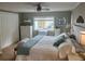 Airy bedroom featuring plenty of storage, neutral walls, and bright sunlight from the windows at 795 Cervina N Dr, Venice, FL 34285