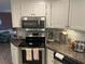 Updated kitchen with stainless steel appliances and ample counter space at 795 Cervina N Dr, Venice, FL 34285
