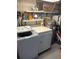 A utility space with a washer, dryer, and water heater at 795 Cervina N Dr, Venice, FL 34285