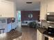 Open floor plan view from kitchen, with chair and decor at 795 Cervina N Dr, Venice, FL 34285