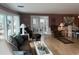 Relaxing living room with view of the dining area featuring hardwood floors and neutral color pallet at 795 Cervina N Dr, Venice, FL 34285