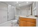 This bathroom features a bathtub and shower combo with wooden vanity at 799 Harrington Lake N Dr # 73, Venice, FL 34293