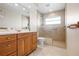 Bright bathroom with vanity, shower, and tiled floor at 799 Harrington Lake N Dr # 73, Venice, FL 34293