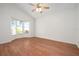 This bedroom boasts wood floors, a ceiling fan, a window nook and lots of natural light at 799 Harrington Lake N Dr # 73, Venice, FL 34293