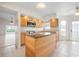Well-lit kitchen showcasing an island, stainless appliances, and granite countertops at 799 Harrington Lake N Dr # 73, Venice, FL 34293