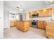 Bright kitchen featuring stainless appliances, a center island, and ample cabinet space at 799 Harrington Lake N Dr # 73, Venice, FL 34293