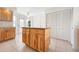 Kitchen island featuring wood cabinets, granite counters and tile flooring at 799 Harrington Lake N Dr # 73, Venice, FL 34293