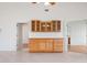 Bright living area featuring tile flooring and a custom cabinet with ample storage at 799 Harrington Lake N Dr # 73, Venice, FL 34293