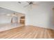 Bright living room featuring wood floors, ceiling fan, and an open layout at 799 Harrington Lake N Dr # 73, Venice, FL 34293