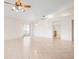 Open living area featuring tile floors, ceiling fan and a sliding glass door to the lanai at 799 Harrington Lake N Dr # 73, Venice, FL 34293
