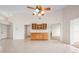 Spacious living room showcasing high ceilings, tile floors, and custom-built cabinetry at 799 Harrington Lake N Dr # 73, Venice, FL 34293