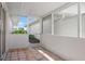 This tiled patio features a view of a garden space and plenty of natural light at 799 Harrington Lake N Dr # 73, Venice, FL 34293