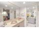 Bathroom featuring a vanity, lots of storage and views to another vanity and bedroom at 810 Capri Isles Blvd # 230, Venice, FL 34292