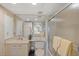 Bathroom featuring a vanity, toilet, and glass-enclosed shower, complete with neutral decor at 810 Capri Isles Blvd # 230, Venice, FL 34292