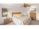 Bright bedroom with ceiling fan, woven furniture and view of the grounds at 810 Capri Isles Blvd # 230, Venice, FL 34292