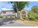 Inviting exterior featuring well-maintained landscaping and attached garages, creating curb appeal at 810 Capri Isles Blvd # 230, Venice, FL 34292