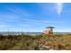 Charming beach with lifeguard tower overlooking soft sands and calm ocean, inviting relaxation and safety at 810 Capri Isles Blvd # 230, Venice, FL 34292