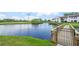 Scenic pond view featuring a bridge and golf course in the background, creating a tranquil atmosphere at 810 Capri Isles Blvd # 230, Venice, FL 34292