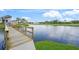 Picturesque pond view with a wooden bridge, adding charm and serenity to the natural surroundings at 810 Capri Isles Blvd # 230, Venice, FL 34292