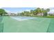 Well-maintained tennis courts surrounded by lush greenery, providing a great space for recreation at 810 Capri Isles Blvd # 230, Venice, FL 34292