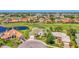 Desirable home in golf community with pond, landscaped yard, manicured green spaces, and serene neighborhood at 854 Blue Crane Dr, Venice, FL 34285