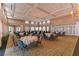 Spacious ballroom with elegant chandelier and formal seating arrangement at Pelican Pointe Golf and Country Club at 854 Blue Crane Dr, Venice, FL 34285