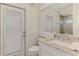 Bathroom featuring a white vanity with granite countertops and a patio door at 854 Blue Crane Dr, Venice, FL 34285